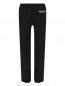 Трикотажные брюки с принтом Moschino  –  Общий вид
