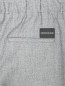 Брюки из шерсти свободного кроя на резинке Calvin Klein  –  Деталь