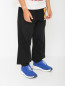 Трикотажные брюки с принтом Moschino  –  МодельВерхНиз