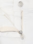 Джинсы с декоративными потертостями Dolce & Gabbana  –  Деталь1