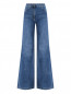 Расклешенные джинсы с карманами Moschino  –  Общий вид