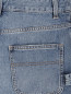 Свободные шорты из потертого денима Moschino Couture  –  Деталь