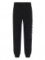 Трикотажные брюки с принтом Givenchy  –  Общий вид