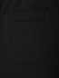 Трикотажные брюки с принтом Moschino  –  Деталь1