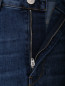 Расклешенные джинсы с разрезами 3x1  –  Деталь
