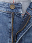 Джинсы зауженного кроя с потертостями Tommy Jeans  –  Деталь1