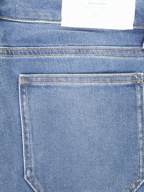 Укороченные джинсы расклешенного кроя - Деталь