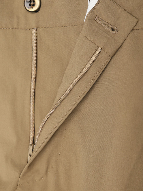 Трикотажные брюки на резинке с карманами - Деталь