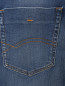 Джинсы зауженного кроя Tommy Jeans  –  Деталь