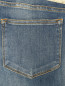 Узкие джинсы из потертого денима, декорированные кристаллами Marina Sport  –  Деталь1