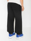 Трикотажные брюки с принтом Moschino  –  МодельВерхНиз1